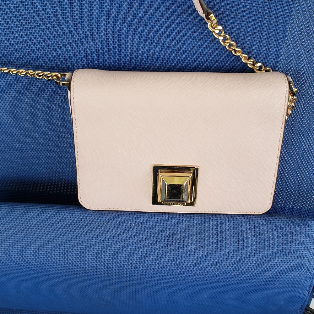 Michael Kors light pink crossbody bag.